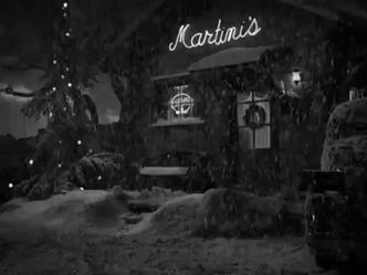 In the Christmas film 'It's a Wonderful Life', what does Clarence receive for accomplishing his mission?