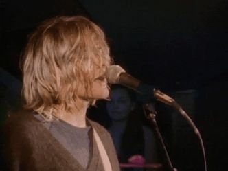 Which Nirvana song begins with the lyrics "Load up on guns, bring your friends"?