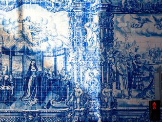 Portugal's tradition of tilework uses decorative ceramic tiles known as azulejos.  What is a common theme they depict?