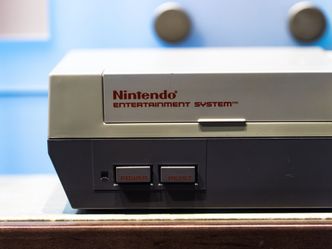 What year did this video game console, branded as the Nintendo Entertainment System (NES), come out? 