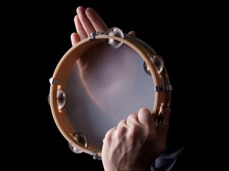 What name is given to the jangling discs on the edges of a tambourine?