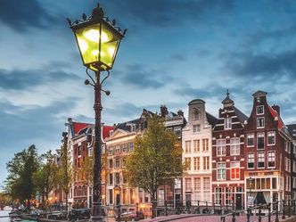 In 2001, Amsterdam was the first capital city in the world to allow what?