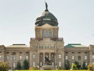 This capitol building has a dome covered with copper and can be found in which state?