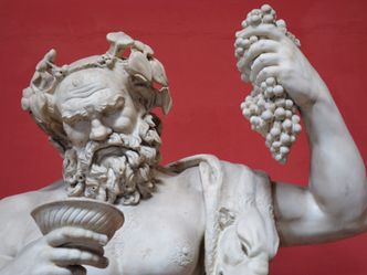 Who is the god of wine according to Greek mythology?