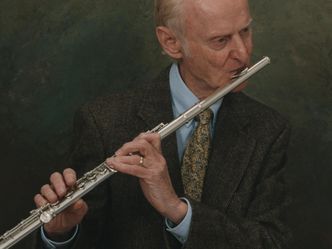 Which woodwind instrument is the man playing?