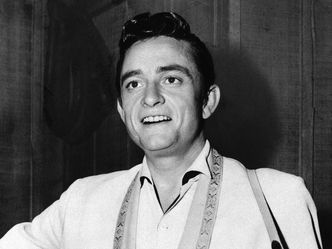 How many feet high was Johnny Cash when he was "still rising" in 1952?