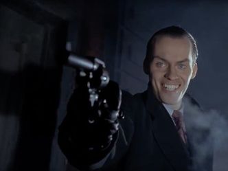 What is the name of the gunman, in this movie, who kills Bruce's parents, and would become the Joker?