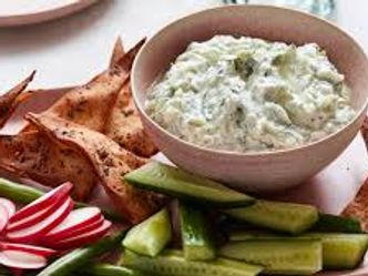 Which Greek dip is made from yoghurt mixed with cucumber, garlic, salt, olive oil and often vinegar or lemon juice?