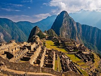 Which famous 15th century city is located on mountain in Peru?