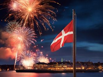 What do Danish people do at midnight to symbolise leaping into the New Year?